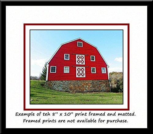 Generic Big Red Dairy Barn. A fine art photograph of a pretty red dairy barn with a Gambrel roof. Wonderful double-X brace doors!