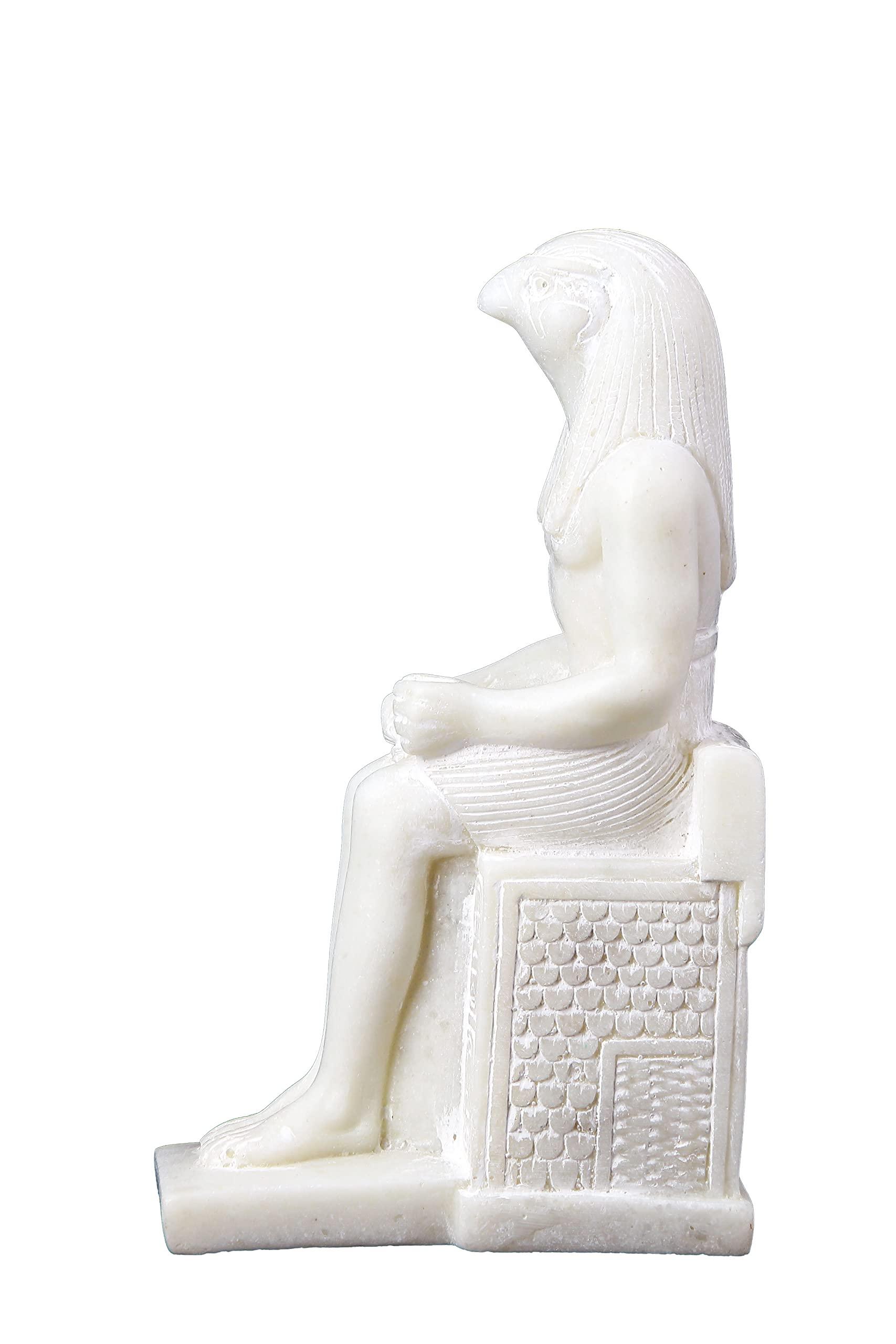 HomeLoft Basics Unique ancient Egyptian Falcon Bird god Horus seated statue marble stone made in Egypt. His name means he who is above and he who is distant. He was a god of the sky and war.